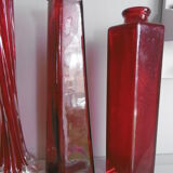 Set of three red bottles