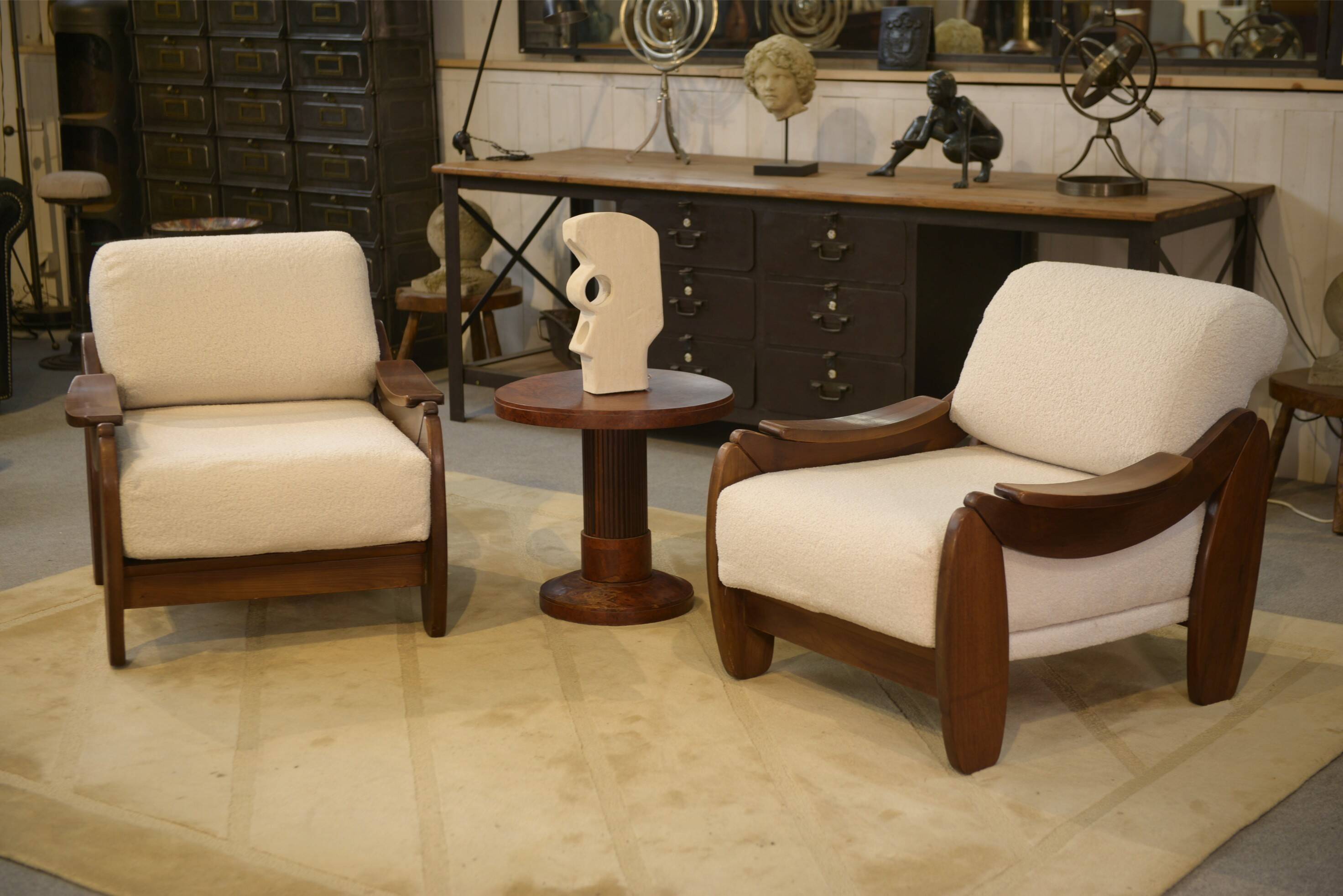 Brutalist pair of armchairs in mahogany and cream boucle 1970s.