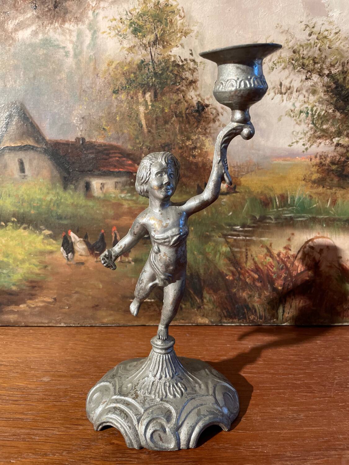 Old cherub candle holder