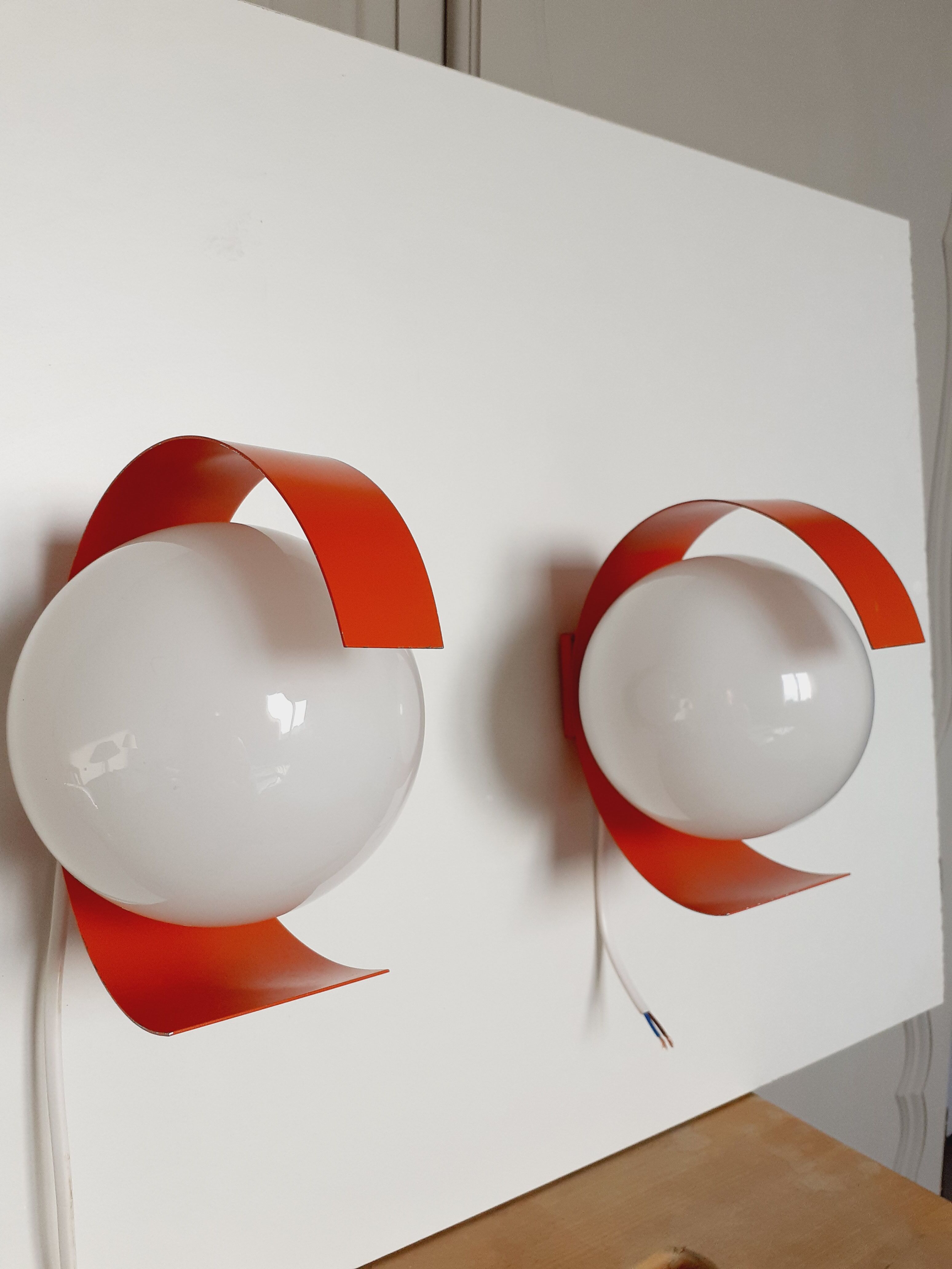 Pair of orange space age wall lamps