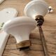 Set of 2 Porcelain door handles and cleanliness plates