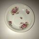 Hollow dish in fired porcelain with floral motifs