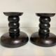Pair of black stained wooden candlesticks