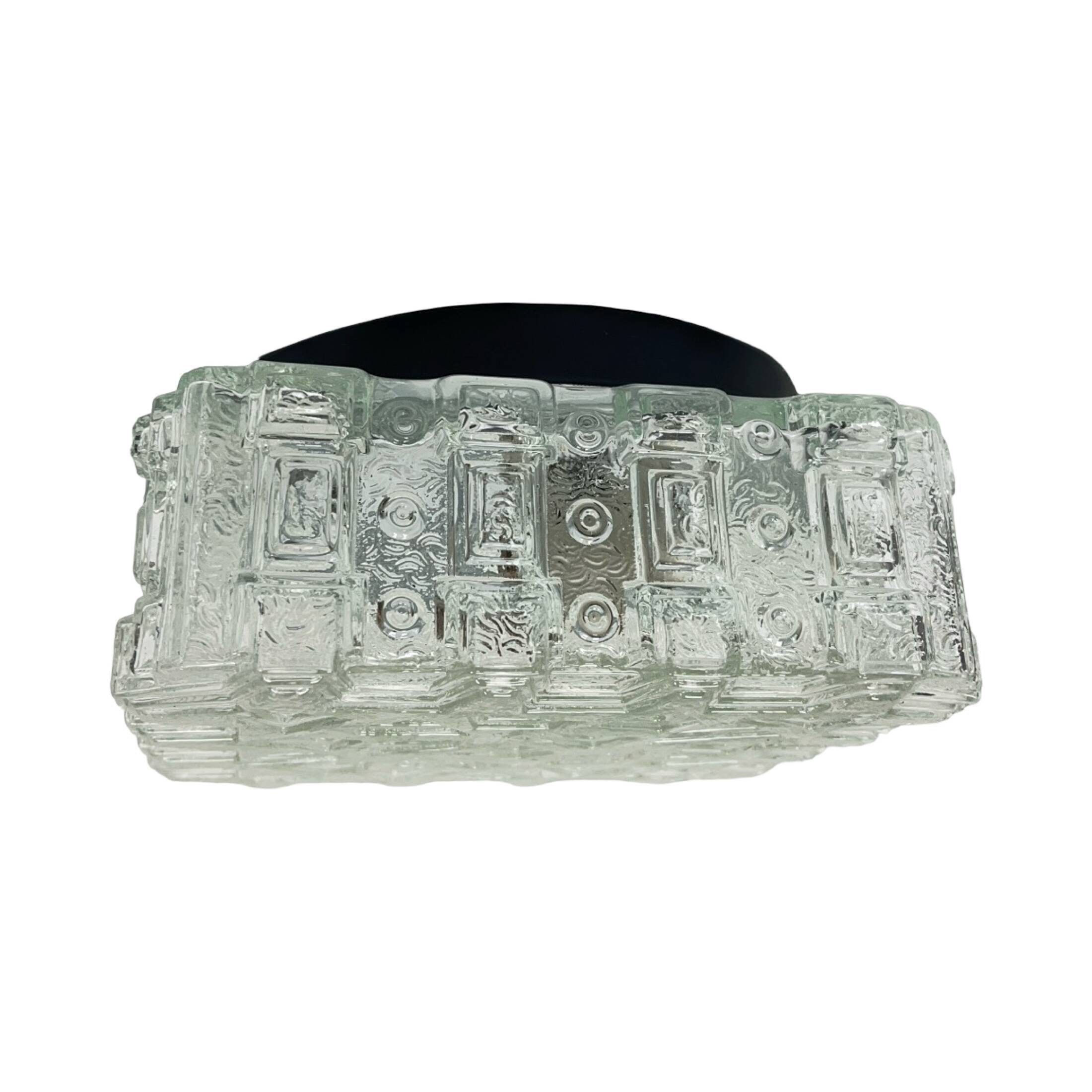 1970s square Hillebrand ceiling light made of thick pressed glass.