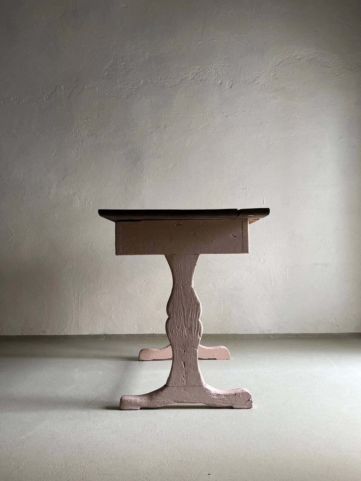 Rustic pink painted desk with brown tabletop
