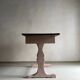 Rustic pink painted desk with brown tabletop