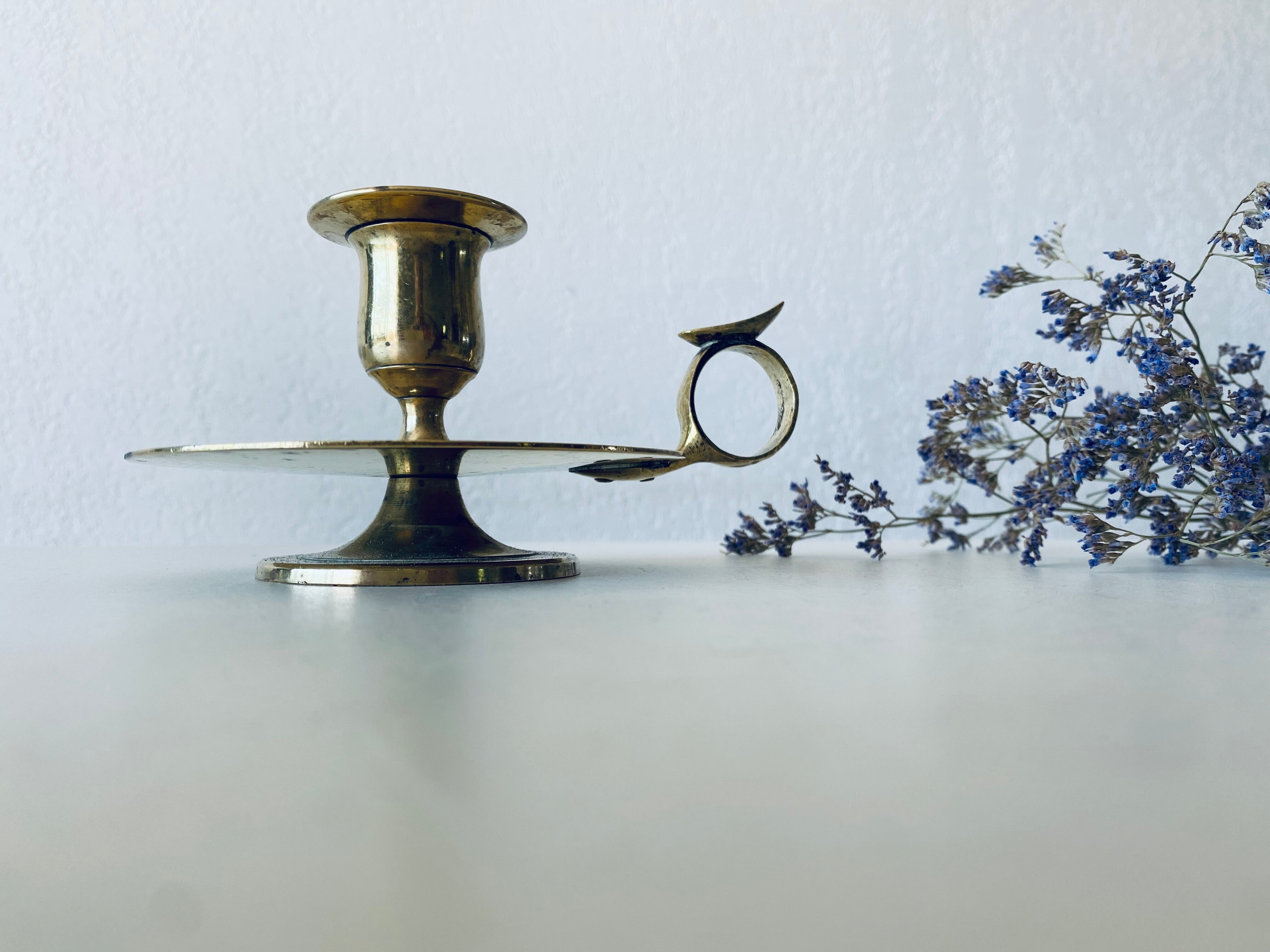 Old candle holder with handle