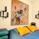 Pair of sculpted lacquered bronze wall lights, Arlus