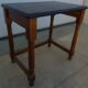 Nightstand or side table in solid wood with a black top.