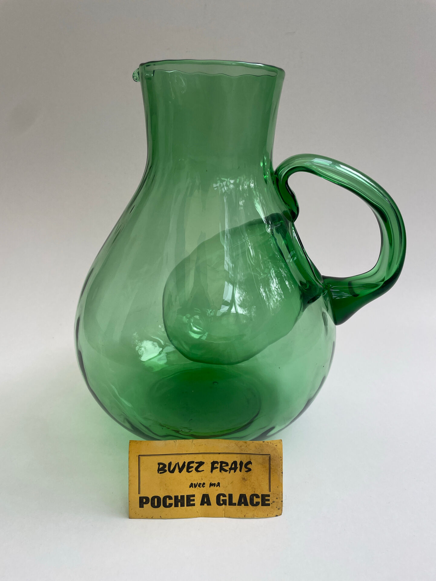 Large green glass cooling jug