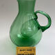 Large green glass cooling jug