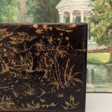 Old black wooden box with Asian décor