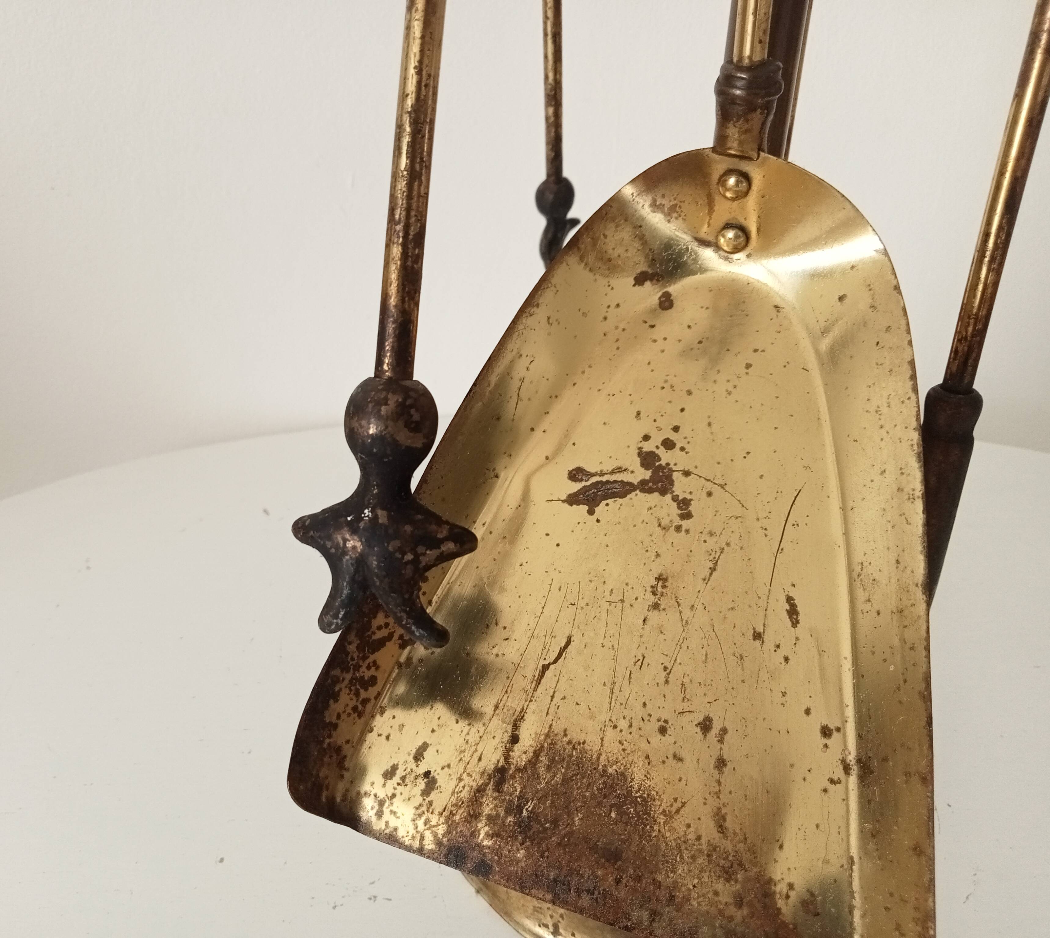 Old brass fireplace servant
