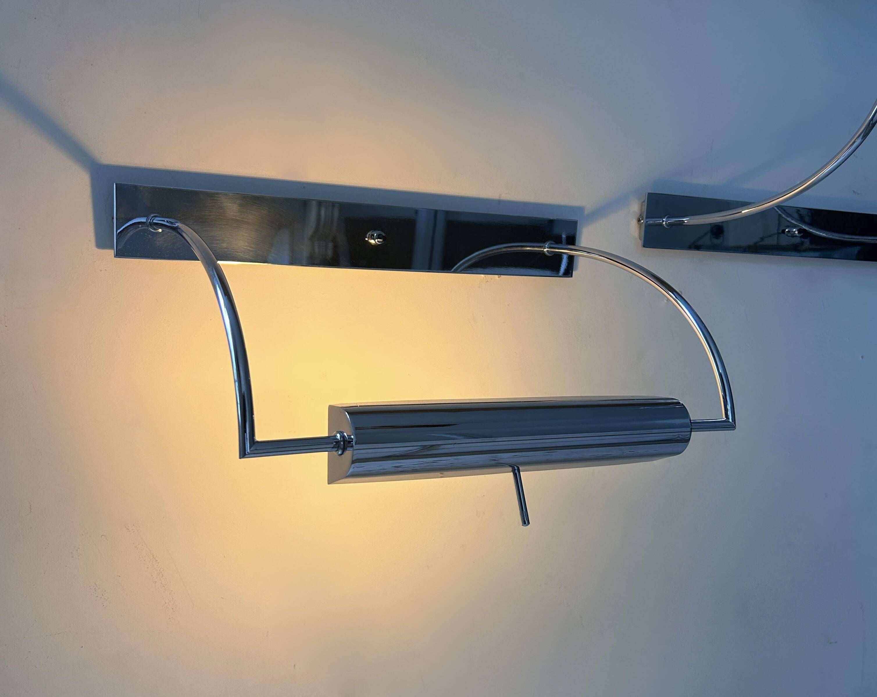 Pair of vintage adjustable wall lights, chrome metal, France 1970.