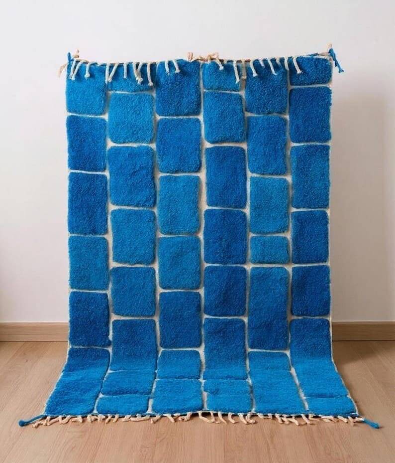 Handmade traditional pure wool carpet with blue patterns.