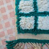 Moroccan hallway rug with inverted pine green and white checkerboard
