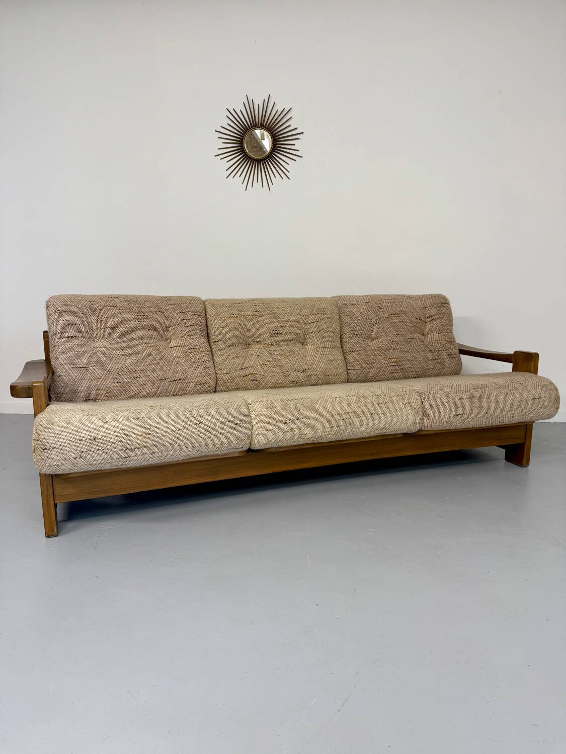 Old 3-seater sofa in solid wood, Maison Regain design, from the 70s.