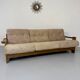 Old 3-seater sofa in solid wood, Maison Regain design, from the 70s.