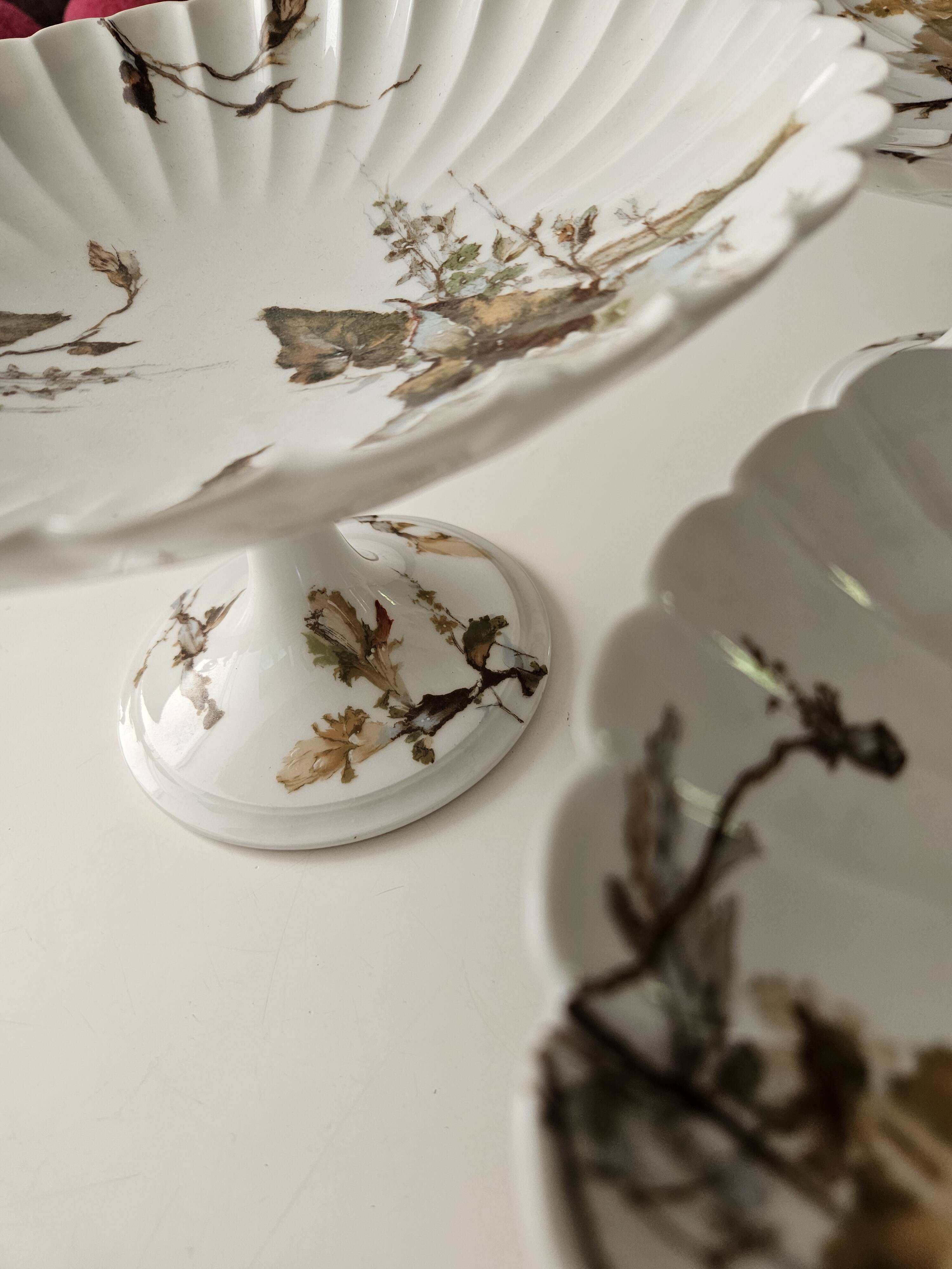 Haviland service plates, dishes on pedestals and soup tureen