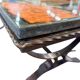 Vintage stone coffee table with a cast iron frame.