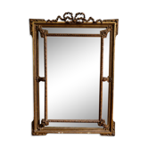 Large Napoleon III mirror 130 × 93 cm — gilded frame sculpted with ribbon pediment.