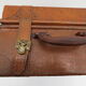 Rectangular wooden suitcase covered with leather