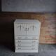 Mid-century wooden dresser painted in cream white, with 2 doors and 4 drawers, brass fittings.