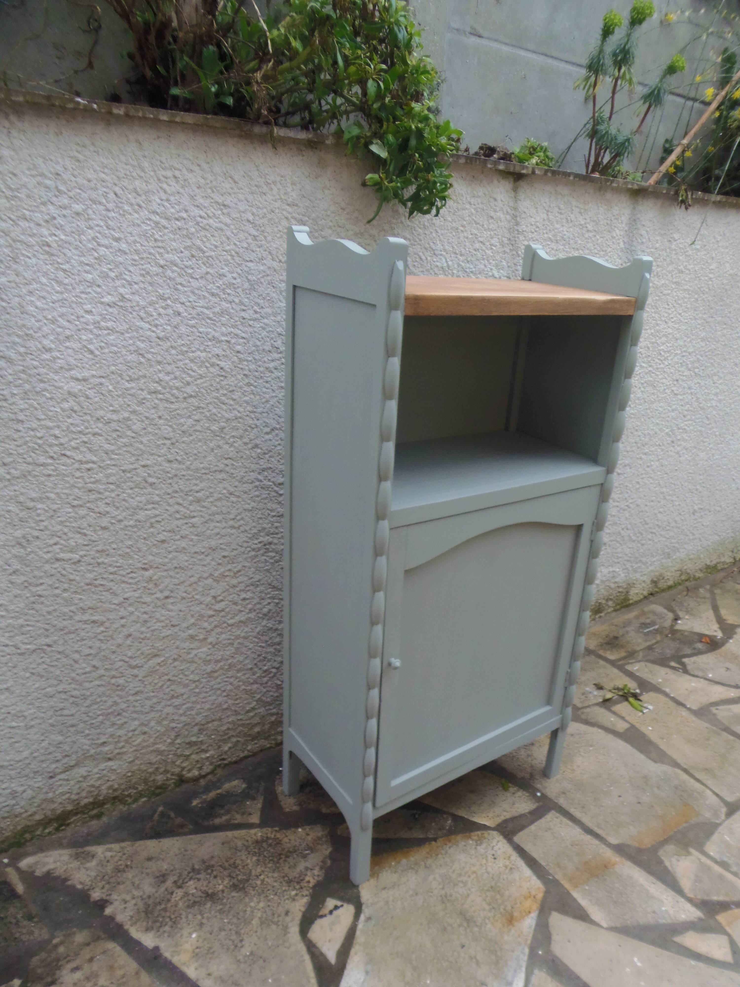 Vintage furniture of shallow depth re-enchanted in grey-green.