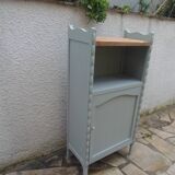 Vintage furniture of shallow depth re-enchanted in grey-green.