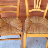 Set of 5 mismatched straw chairs.