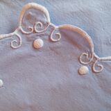 Embroidered drapery and baby's bed adornment