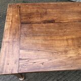 Antique solid cherry farmhouse table with 2 end drawers and 1 pull-out.