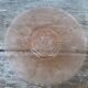 Art Deco plate in moulded pressed glass with a daisy pattern.