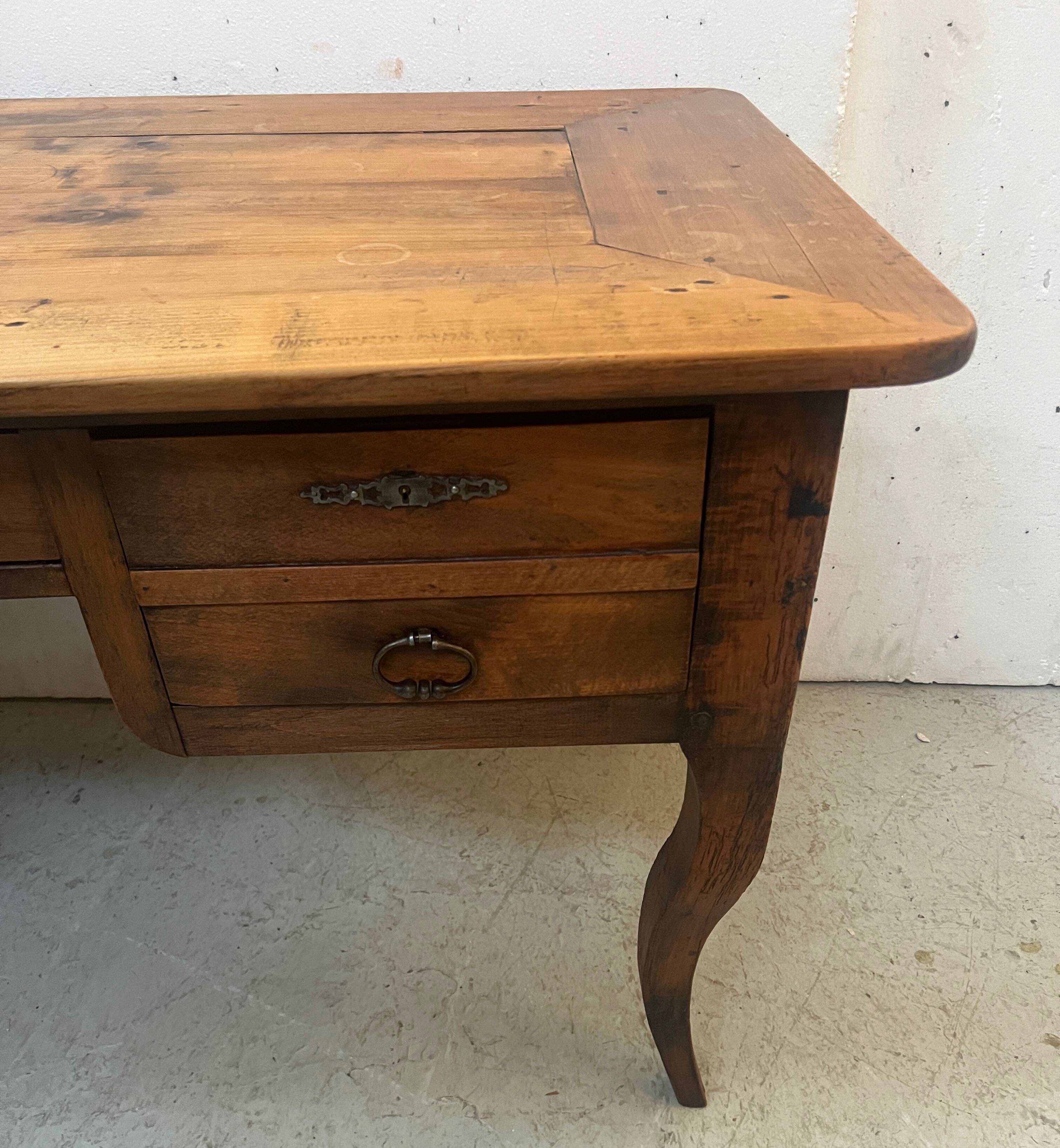 Provincial desk made of solid cherry wood, 20th century.