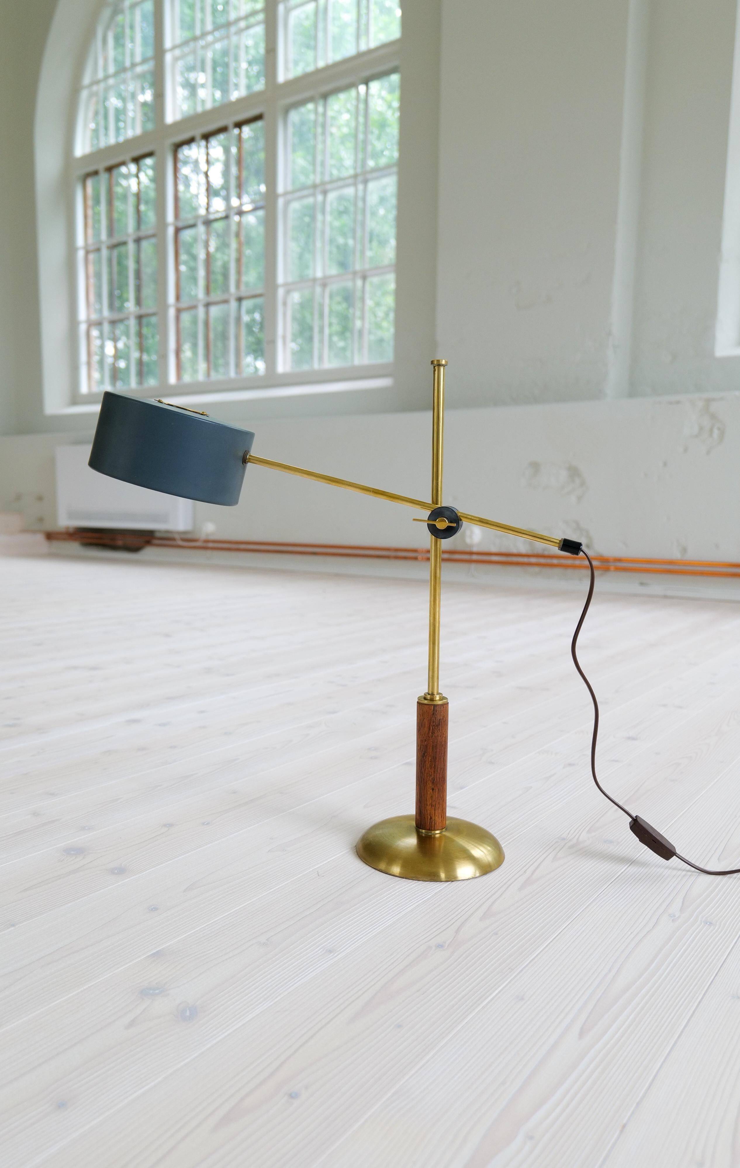 Mid-century modern table lamp in brass and walnut, rare by Einar Bäckström, Sweden.