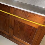 Antique wood and marble kitchen sideboard with carved backsplash
