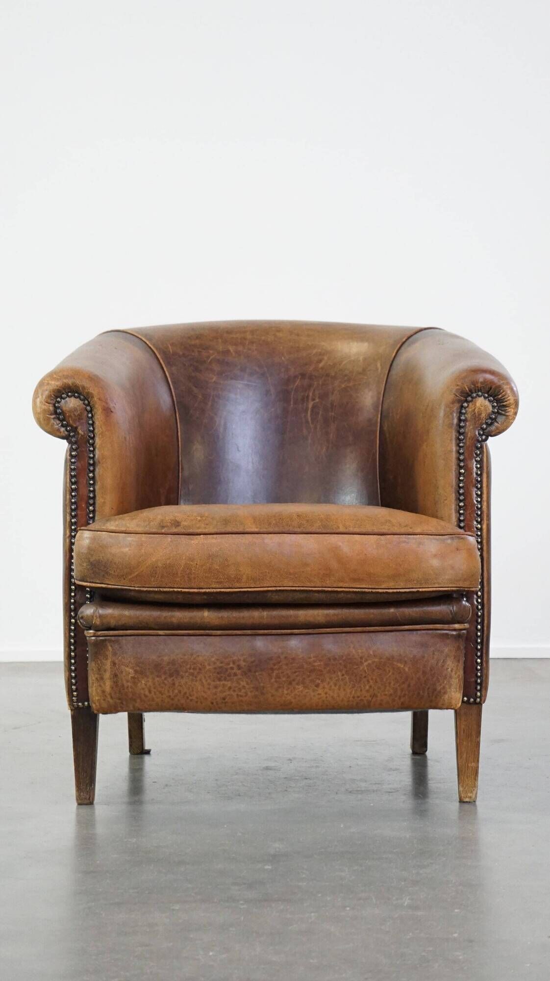 Characterful sheepskin leather club armchair with a luxurious, rustic appearance
