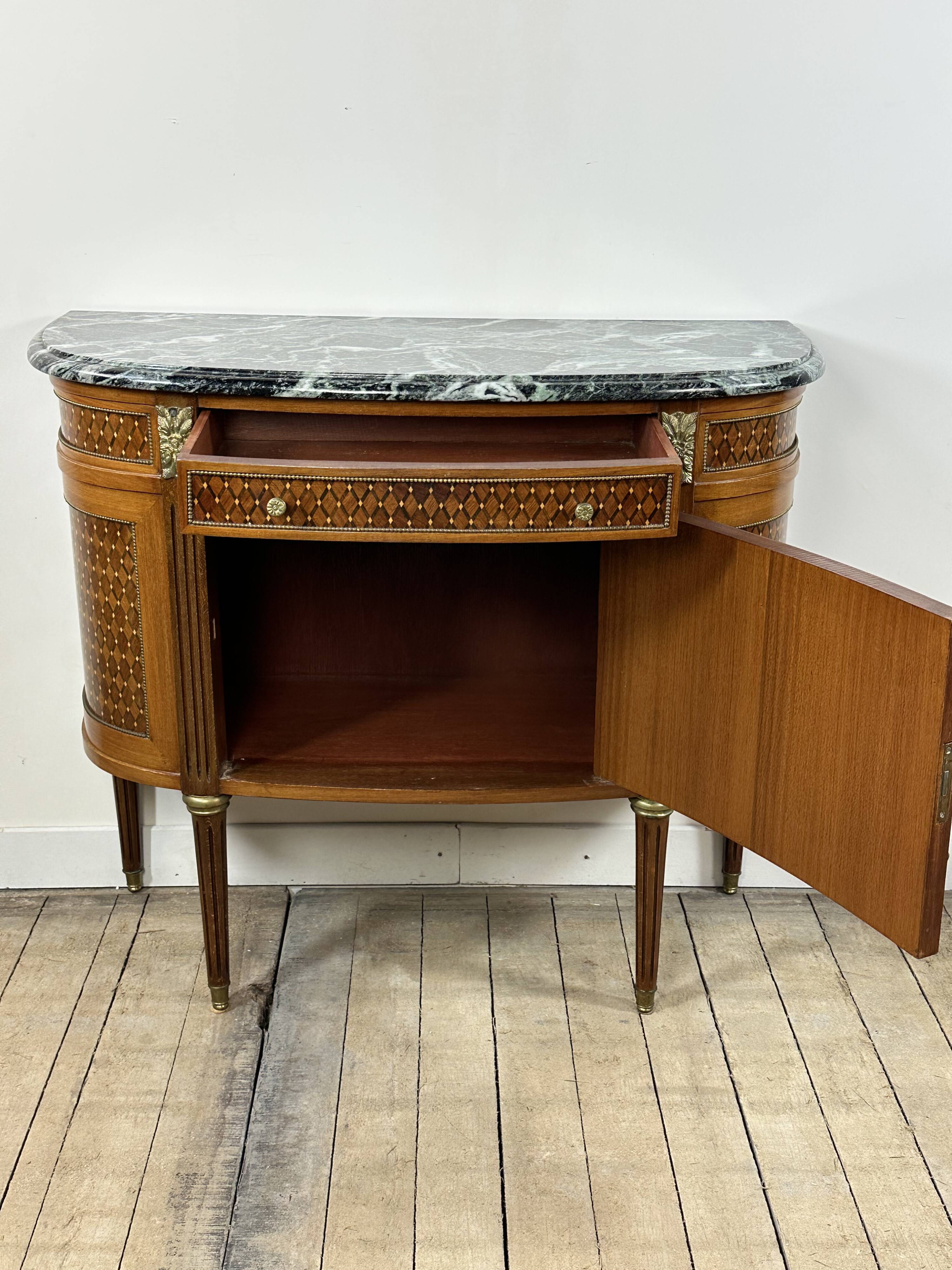 Half-moon commode in the Louis XVI style