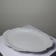 Antique deep dish in white Limoges porcelain, with rockwork relief.