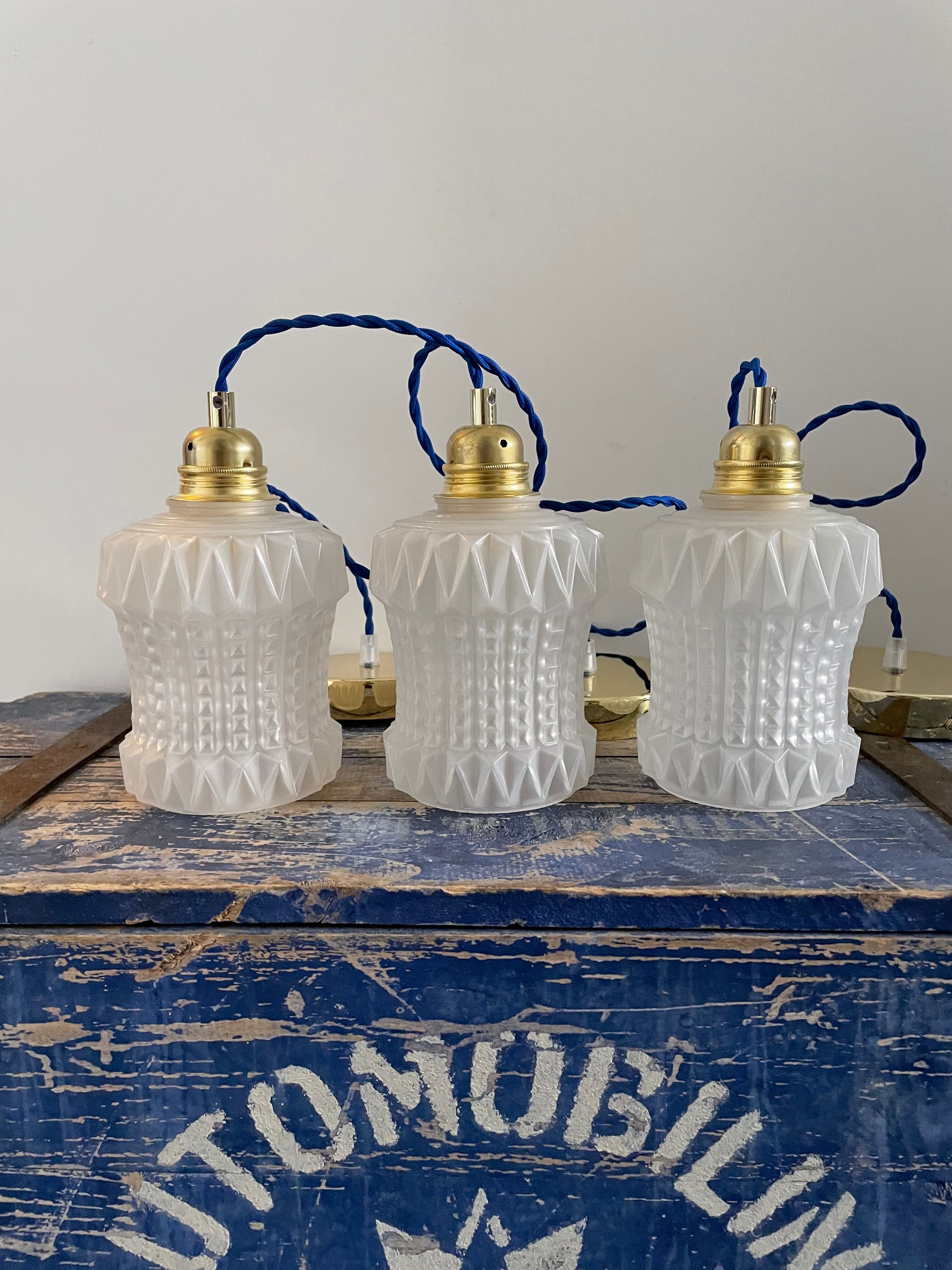 Set of three vintage electrified white glass pendant lamps with new