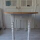 Oval table with beaded grey patinated flaps, wooden tray