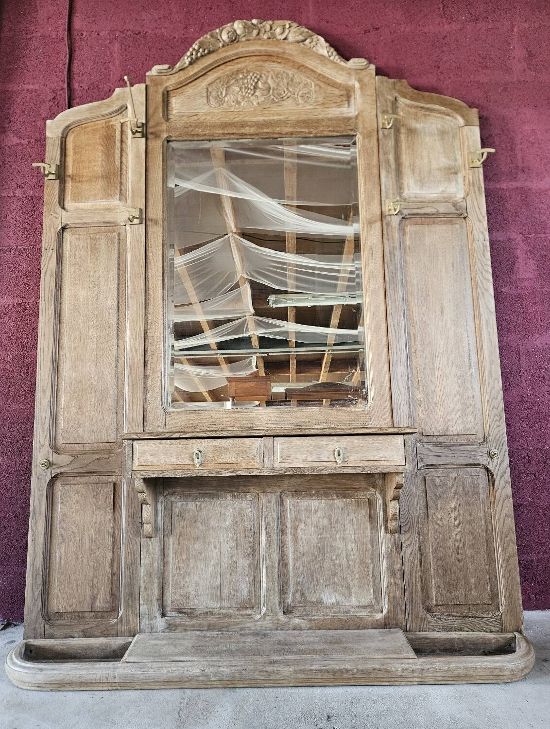Antique oak entrance hall wardrobe. Mirror. Early 20th century.
