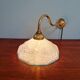 Brass and blue speckled glass wall light