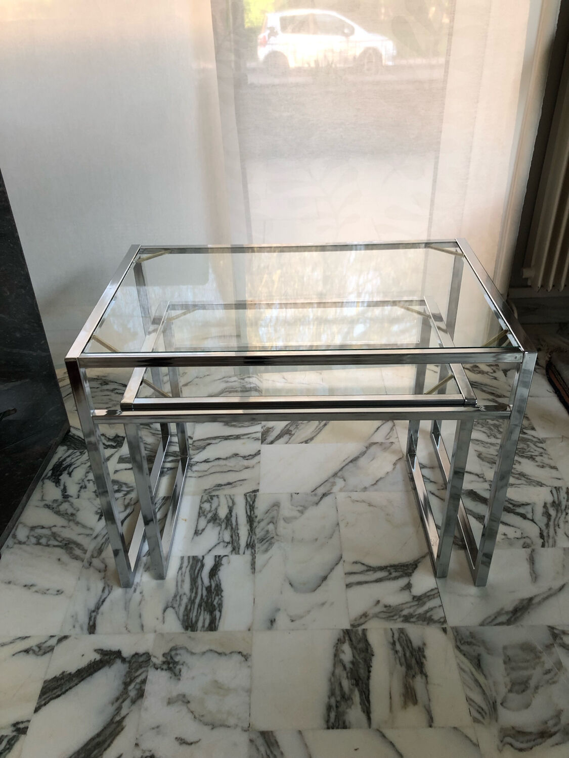 Nested tables in chrome metal and glass, Italy circa 1970.