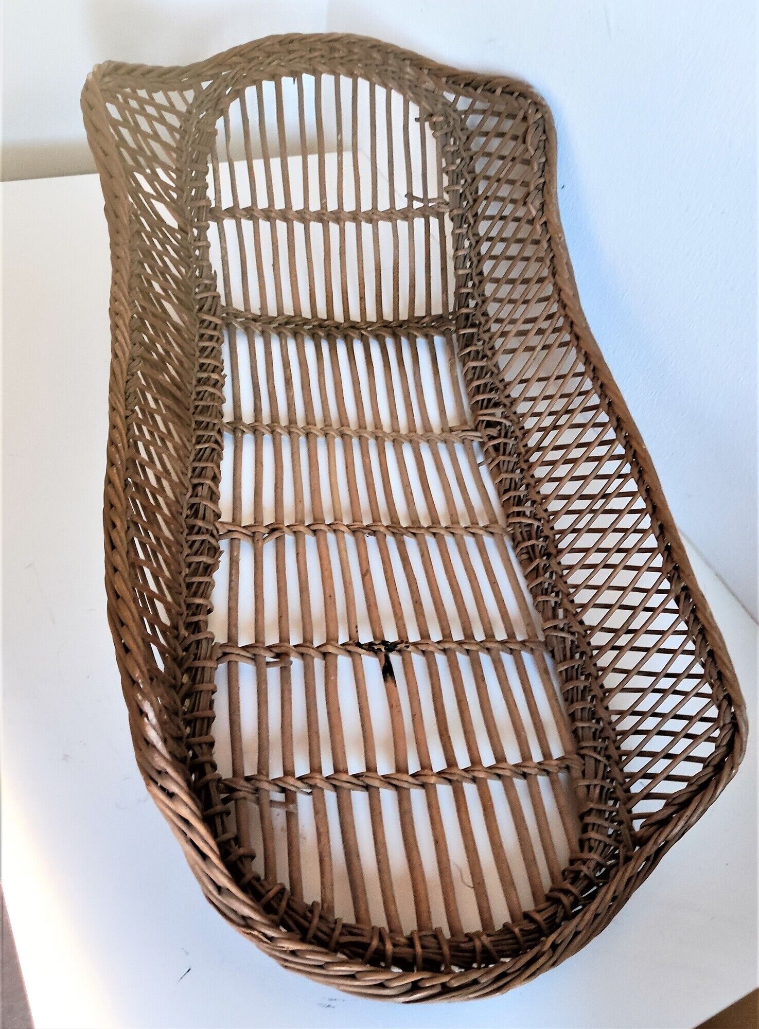 Rattan wicker woven bamboo bassinet or vintage bread pan
