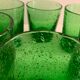 6 green whiskey glasses, bubbles and Biot soufflés