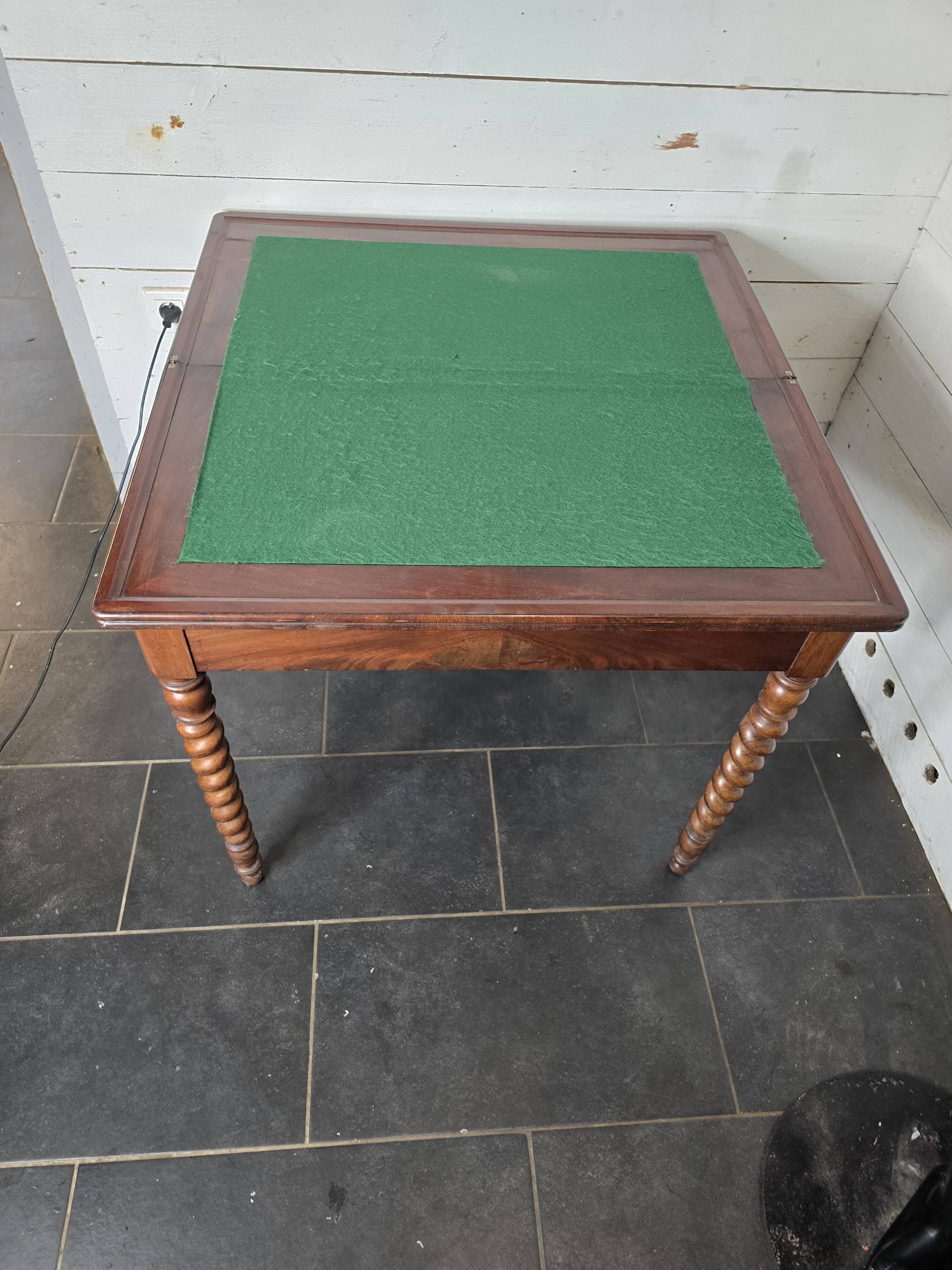 Old mahogany game table