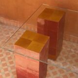 Modern coffee table in burgundy zellige with a tempered glass top.