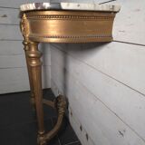 Louis XVI style console in gilded wood with a marble top.