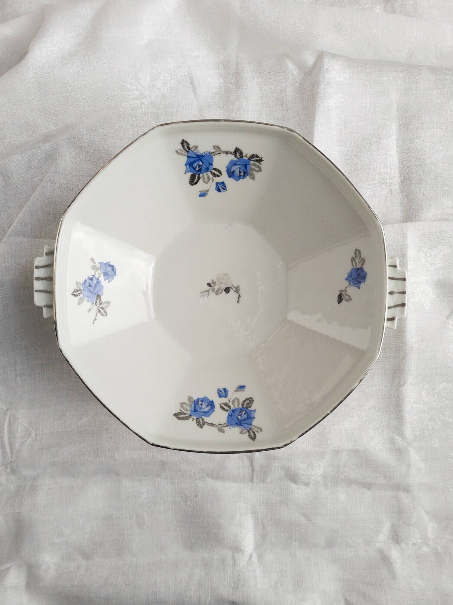 Old porcelain hollow dish of Limoges blue flowers